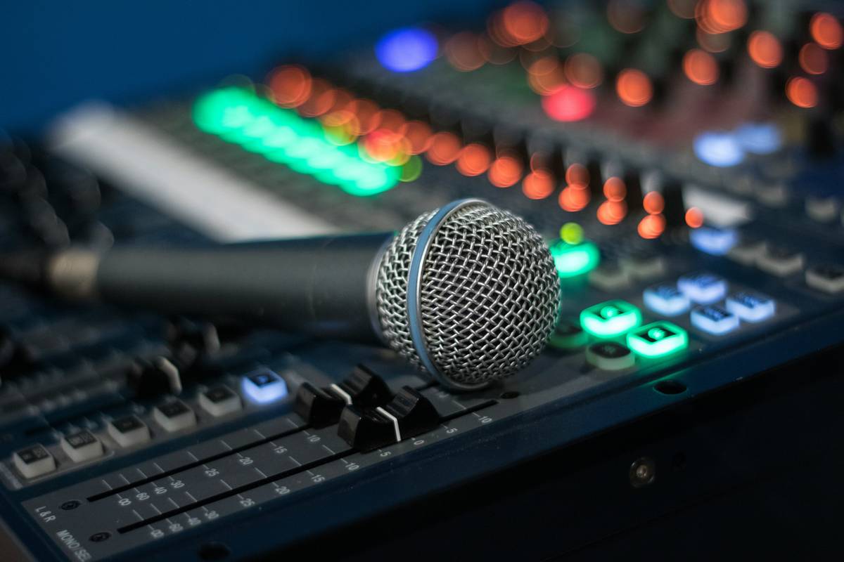 podcast studio equipment layout showing mic placement and acoustic treatment