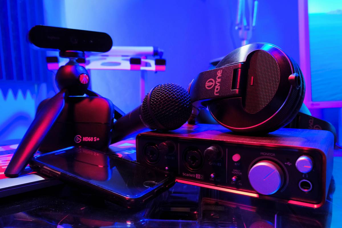 podcast microphone stand holding a condenser mic on a boom arm with shock mount in a home studio